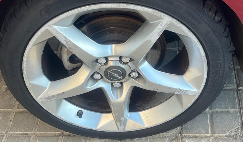 
								Opel Astra 2006 lleno									