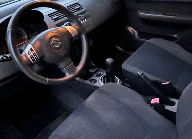 
								Suzuki Swift 2010 lleno									